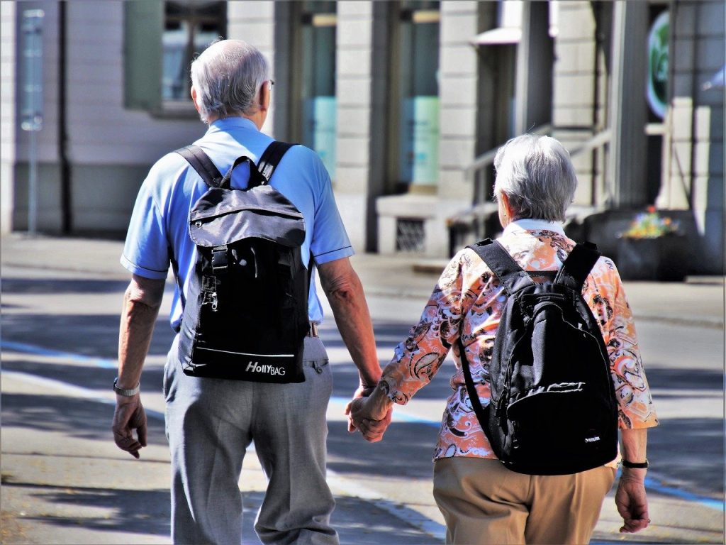 senior couple holding hands
