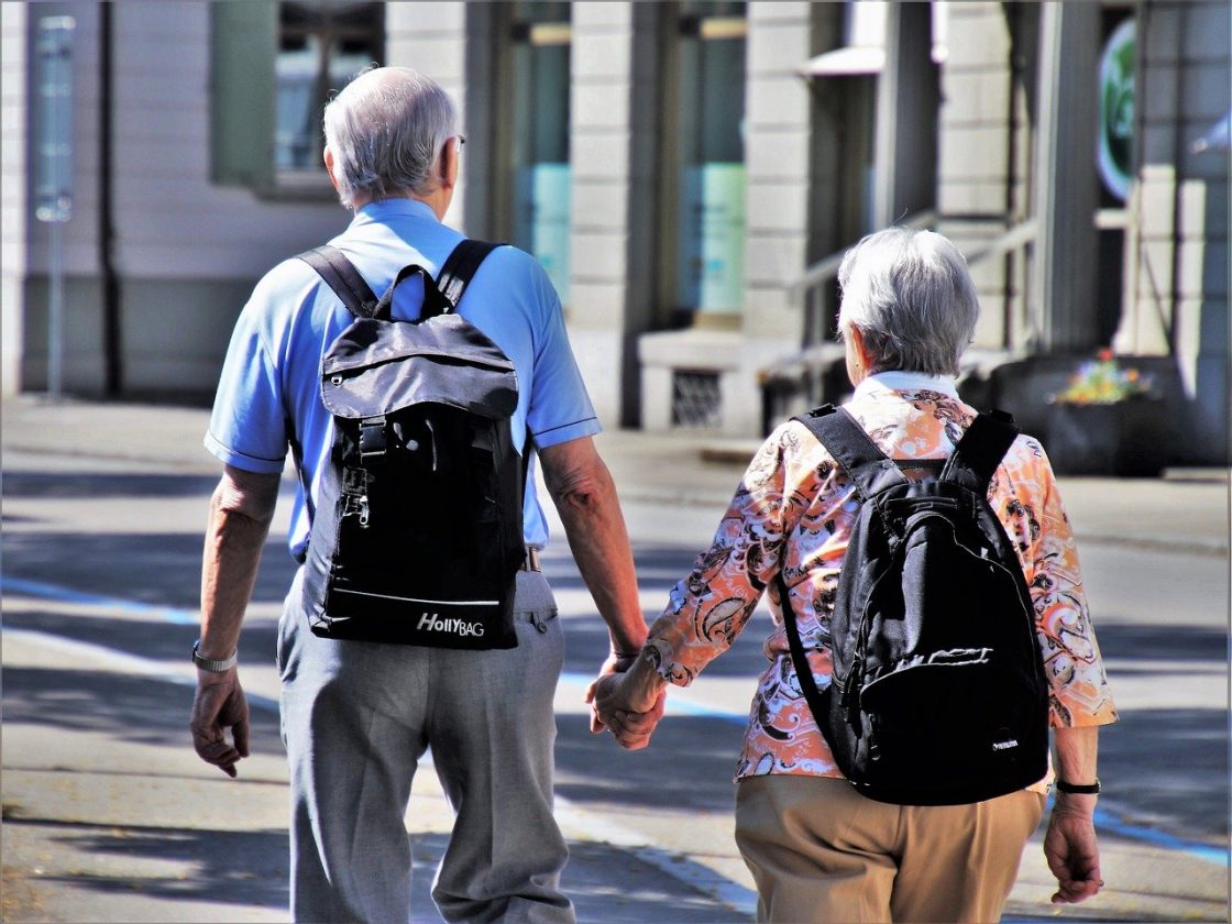 senior couple holding hands